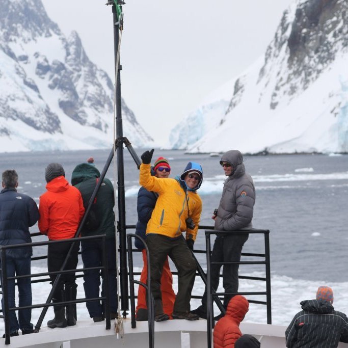 Guests checking out possible ski lines from the boat.