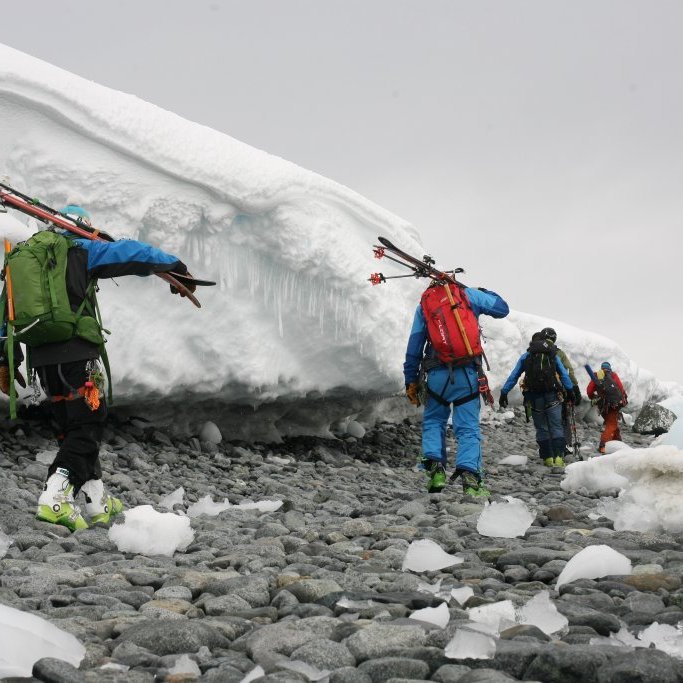 walking along the shore to meet meet the zodiac for a ride back the boat
