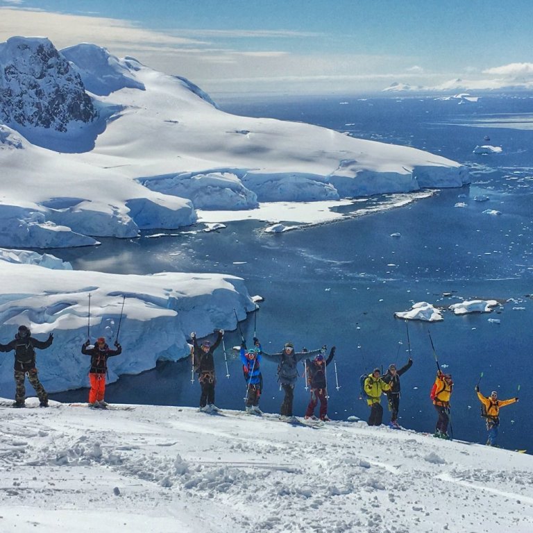 Happy skiers on a bluebird day of riding