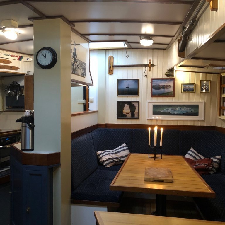 Dining area aboard your floating accommodation.