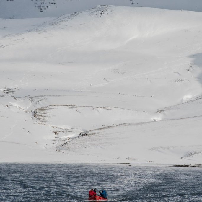 Zodiac between the boat and shore.