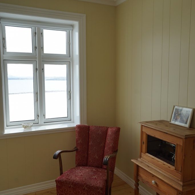 One of the two bedrooms on the main floor of  Karlsa lodge with a view of the fjord