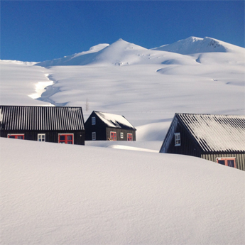 Guest cabins at Klængshóll Lodge with a few ski runs in the backyard.